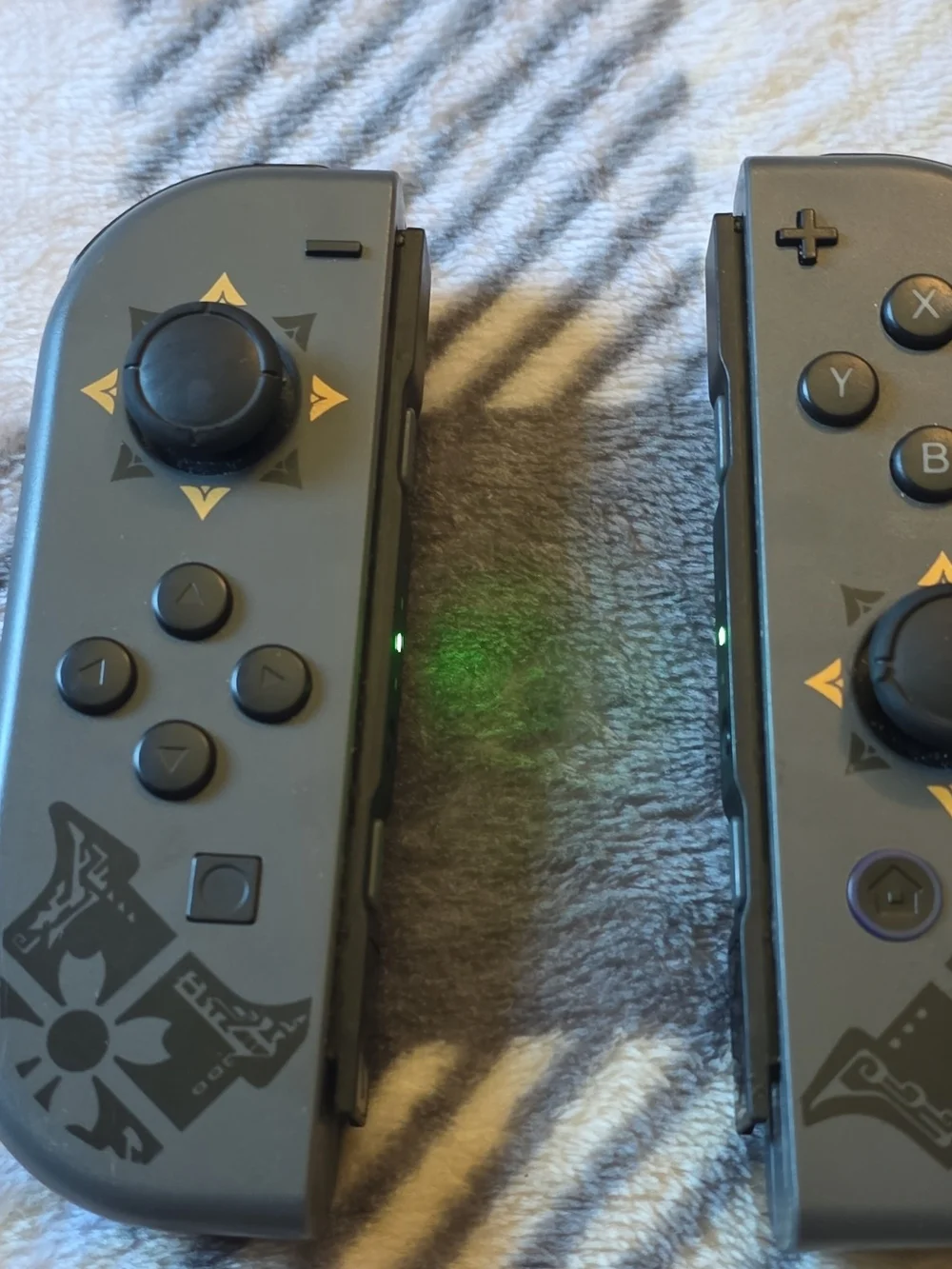 Nintendo Joy-Con Controllers in Dark Gray with Gold Accents